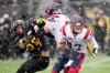 Montreal Alouettes quarterback Trevor Harris (17) scrambles as offensive lineman Landon Rice (55) blocks Hamilton Tiger-Cats defensive end Julian Howsare (95) during first half CFL division semi-final football action in Hamilton, Ont., on Sunday, November 28, 2021. THE CANADIAN PRESS/Nathan Denette