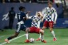 Vancouver Whitecaps' Emmanuel Sabbi (11) and Real Salt Lake's Alexandros Katranis, centre, vie for the ball as Sergi Solans (22) watches during the second half of an MLS soccer match in Vancouver, on Saturday, February 21, 2026. THE CANADIAN PRESS/Ethan Cairns