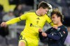 Nashville SC midfielder Reed Baker, left, heads the ball over Atletico Ottawa forward Emiliano García, right, during the first half of a first round CONCACAF Champions Cup soccer match Tuesday, Feb. 24, 2026, in Nashville, Tenn. (AP Photo/George Walker IV)