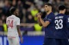 PSG's Achraf Hakimi, center, celebrates after scoring his side's second goal during the first-leg of the Champions League playoff soccer match between Monaco and Paris Saint-Germain in Monaco, Tuesday, Feb. 17, 2026. (AP Photo/Philippe Magoni)