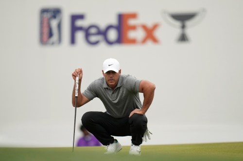 Brooks Koepka lines up a putt at the 16th green during the first round of the Phoenix Open golf tournament at the TPC Scottsdale Stadium Course Thursday, Feb. 5, 2026, in Scottsdale, Ariz. (AP Photo/Ross D. Franklin)