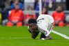 Real Madrid's Vinicius Junior reacts after sustaining an injury during the second leg of the Champions League playoff soccer match between Real Madrid and Benfica in Madrid, Spain, Wednesday, Feb. 25, 2026. (AP Photo/Manu Fernandez)