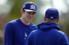 Los Angeles Dodgers pitcher Roki Sasaki (11) works out during spring training baseball on Sunday, Feb. 22, 2026, in Phoenix. (AP Photo/Brynn Anderson)