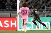 Los Angeles FC forward Denis Bouanga (99) celebrates after scoring a goal as Inter Miami defender Maximiliano Falcón (37) watches during the second half of an MLS soccer match, Saturday, Feb. 21, 2026, in Los Angeles, Calif. (AP Photo/Jessie Alcheh)
