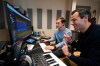 Mikey Shulman, one of the founders of AI music generator startup Suno, right, and research scientist Christian Steinmetz, collaborate on creating a song, Tuesday, Jan. 13, 2026, in Cambridge, Mass. (AP Photo/Robert F. Bukaty)