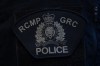 An RCMP patch is worn by an officer at RCMP 
