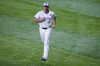 FILE -Toronto Blue Jays' pitcher Max Scherzer runs prior to Game 7 of baseball's World Series against the Los Angeles Dodgers, Nov. 1, 2025, in Toronto. (AP Photo/Ashley Landis, File)