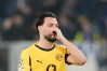 Dortmund's Ramy Bensebaini reacts during the Champions League second leg playoff match between Atalanta and Borussia Dortmund in Bergamo, Italy, Wednesday, Feb. 25, 2026. (Spada/LaPresse via AP)