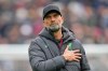FILE - Liverpool's manager Jurgen Klopp gestures to fans at the end of the English Premier League soccer match between West Ham United and Liverpool at London stadium in London, on April 27, 2024. (AP Photo/Kin Cheung, File)