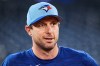FILE - Toronto Blue Jays' Max Scherzer (31) looks on before batting practice Saturday, Oct. 18, 2025, in Toronto, a day ahead of Game 6 in baseball's American League Championship Series against the Seattle Mariners. (Sammy Kogan/The Canadian Press via AP, File)