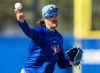 Toronto Blue Jays pitcher Kevin Gausman makes a throw to first base during a drill at Spring Training in Dunedin, Fla., on Monday, Feb. 16, 2026. THE CANADIAN PRESS/Frank Gunn