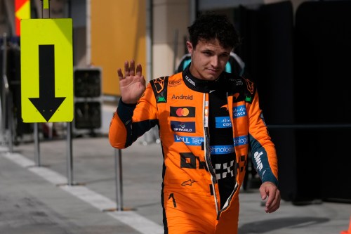 McLaren driver Lando Norris of Britain walks back to his garage during a Formula One pre-season test at the Bahrain International Circuit in Sakhir, Bahrain, Thursday, Feb. 12, 2026. (AP Photo/Altaf Qadri)