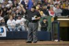 FILE - Home plate umpire Bruce Froemming signals to the official scorer during the fifth inning of a baseball game May 20, 2007, in Milwaukee. (AP Photo/Morry Gash, File)