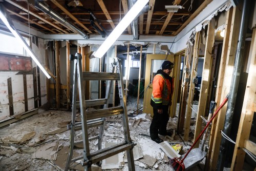Crews work to clean up the basement of a home on the Pimicikamak Cree Nation during a tour with politicians and media at Pimicikamak Cree Nation, Man., on Wednesday, Jan. 7, 2026. THE CANADIAN PRESS/John Woods