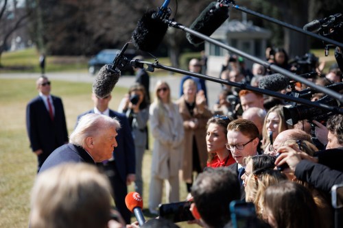 President Donald Trump speaks to reporters before departing on Marine One from the South Lawn of the White House, Friday, Feb. 27, 2026, in Washington. (AP Photo/Tom Brenner)