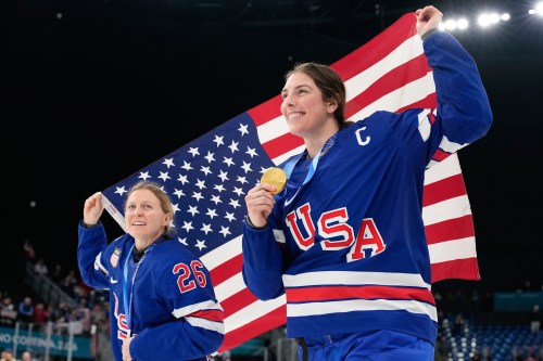United States' Kendall Coyne, left, and United States' Hilary Knight celebrate after victory ceremony for women's ice hockey at the 2026 Winter Olympics, in Milan, Italy, Thursday, Feb. 19, 2026. (AP Photo/Hassan Ammar)