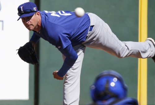 FILE - Italy's Dan Serafini throws before the first inning of an exhibition spring training baseball game against the Los Angeles Angels Wednesday, March 6, 2013, in Tempe, Ariz. (AP Photo/Morry Gash, File)