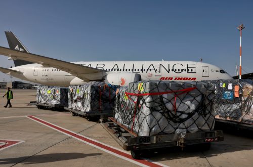 FILE -Workers load medical aid onto an Air India plane to be flown to India, at Ben Gurion Airport near Tel Aviv, Israel, May 4, 2021. (Menahem Kahana/Pool Photo via AP, File)