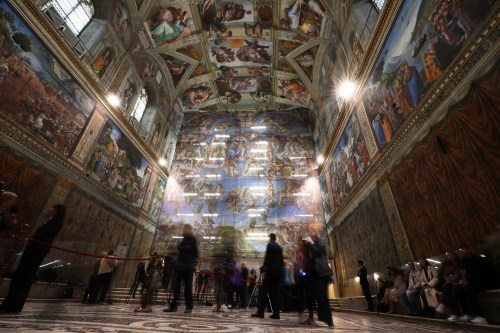 A screen with a replica of “The Last Judgment,” superimposed on it covers the scaffolding used for its extraordinary maintenance during a presentation for press in the Sistine Chapel at the Vatican, Saturday, Feb. 28, 2026. (AP Photo/Alessandra Tarantino)