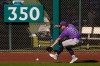 Colorado Rockies left fielder Zac Veen chases a double hit by Texas Rangers' Josh Jung during the fourth inning of a spring training baseball game Sunday, Feb. 22, 2026, in Surprise, Ariz. (AP Photo/Charlie Riedel)