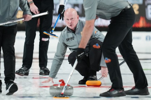 Kevin Koe throws a rock during Canadian Olympic curling trials action against Team Dunstone in Halifax, Tuesday, Nov. 25, 2025. THE CANADIAN PRESS/Darren Calabrese