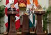 Prime Minister Mark Carney looks on as Indian Prime Minister Narendra Modi delivers a statement during a presentation of agreements and joint statements in New Delhi, India, Monday, March 2, 2026. THE CANADIAN PRESS/Adrian Wyld
