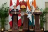 Indian Prime Minister Narendra Modi  looks on as Prime Minister Mark Carney delivers remarks following the presentation of agreements and joint statements in New Delhi, India, Monday, March 2, 2026.  THE CANADIAN PRESS/Adrian Wyld