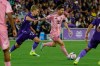 Inter Miami CF forward Lionel Messi, right, controls the ball as he is defended by Orlando City SC midfielder Colin Guske, left, during the first half of an MLS soccer match, Sunday, March 1, 2026, in Orlando, Fla. (AP Photo/Kevin Kolczynski)