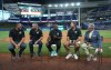 FILE - From left to right, former Florida Marlins players Carl Pavano, Jeff Conine, Juan Pierre, Josh Beckett and announcer Tommy Hutton commemorate the 20th anniversary of the Marlins 2003 World Series championship before the baseball game between the Miami Marlins and the New York Yankees, Aug. 11, 2023, in Miami. (AP Photo/Jim Rassol)