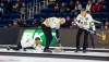Manitoba's Matt Dunstone releases the stone as teammates Ryan Harnden and EJ Harnden sweep the stone during Draw 8 the Montana's Brier in St. John's, N.L., on March 2, 2026. THE CANADIAN PRESS/Paul Daly