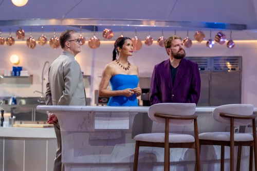This image released by CBS shows, from left, Wylie Dufresne, Padma Lakshmi, and Michael Cimarusti on the set of the cooking competition series 