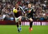 Aston Villa's Leon Bailey, left, and Leeds United's Gabriel Gudmundsson battle for the ball during their English Premier League soccer match in Birmingham, England, Saturday, Feb. 21, 2026. (Bruce Rollinson/PA via AP)