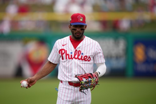 FILE - Philadelphia Phillies' Johan Rojas warms up before a spring training baseball game, Thursday, Feb. 26, 2026, in Clearwater, Fla. (AP Photo/Matt Slocum, File)