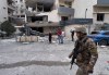 A Lebanese soldier passes in front of a damaged hotel that was hit by an Israeli airstrike in Hazmieh, east of Beirut, Lebanon, Wednesday, March 4, 2026. (AP Photo/Hussein Malla)