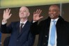 FILE - CAF President Patrice Motsepe and FIFA President Gianni Infantino wave from the tribune during the Africa Cup of Nations round of 16 soccer match between South Africa and Cameroon in Rabat, Morocco, Sunday, Jan. 4, 2026. (AP Photo/Themba Hadebe, File)