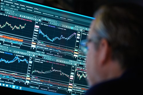 Financial information is displayed on the floor at the New York Stock Exchange in New York, Wednesday, March 4, 2026. (AP Photo/Seth Wenig)