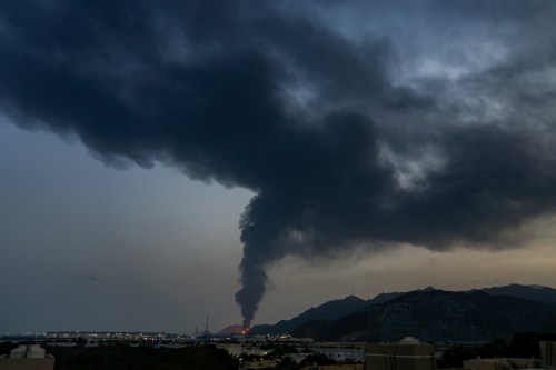 Large fire and plume of smoke is visible after, according to the authorities, debris of an Iranian intercepted drone hit the Fujairah oil facility, in Fujairah, United Arab Emirates, Tuesday, March 3, 2026. (AP Photo/Altaf Qadri)