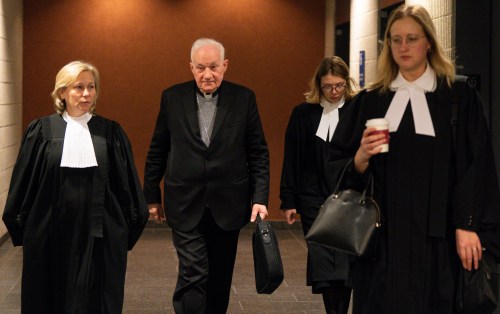 Quebec Cardinal Marc Ouellet, centre, arrives with his lawyers at the courthouse in Montreal on Thursday, March 5, 2026. THE CANADIAN PRESS/Christinne Muschi