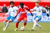 Chicago Fire FC forward Jonathan Bamba (19) is defended by CF Montreal defender Jalen Neal (2) and midfielder Matthew Longstaff (8) during the first half of an MLS soccer match, Saturday, Feb. 28, 2026, in Chicago. (AP Photo/Kamil Krzaczynski)