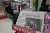 FILE -The Daily Telegraph newspaper with the front page of French President Emanuel Macron is seen at a supermarket in London, March 21, 2024. (AP Photo/Kin Cheung, File)