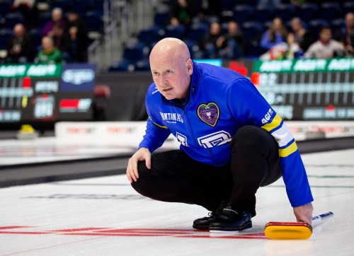 Alberta skip Kevin Koe monitors his stone during Draw 16 at the Montana's Brier Canadian men's curling championship, in St. John's, N.L., on Thursday, March 5, 2026. THE CANADIAN PRESS/Paul Daly