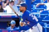 Toronto Blue Jays' Nathan Lukes watches his two-run single off Canada pitcher Noah Skirrow during the second inning of an exhibition baseball game Tuesday, March 3, 2026, in Dunedin, Fla. (AP Photo/Chris O'Meara)