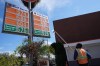 Gas prices are manually increased in Beverly Hills, Calif., Tuesday, March 3, 2026. (AP Photo/Damian Dovarganes)