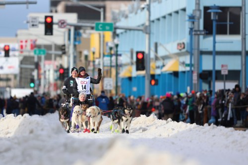FILE - Michelle Phillips (14), of Canada, mushes down Fourth Street during the Ceremonial Start of the Iditarod Trail Sled Dog Race, in Anchorage, Alaska, March 1, 2025. (AP Photo/Amanda Loman, File)