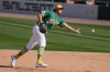 Athletics first baseman Nick Kurtz flips the baseball to the pitcher covering first base to get Milwaukee Brewers' Brice Turang out during the fifth inning of a spring training baseball game Tuesday, Feb. 24, 2026, in Mesa, Ariz. (AP Photo/Ross D. Franklin)