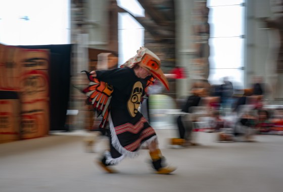Members of the Dancers of Damelahamid, an Indigenous dance company, perform during the Coastal Dance Festival at the Museum of Anthropology, in Vancouver, on Wednesday. (Darryl Dyck / The Canadian Press)