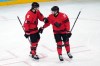 Canada's Shea Theodore (27) is congratulated by Travis Sanheim (6) after Theodore scored a goal against Finland during the third period of a men's ice hockey semifinal game at the 2026 Winter Olympics in Milan, Italy, Friday, Feb. 20, 2026. (AP Photo/Carolyn Kaster)