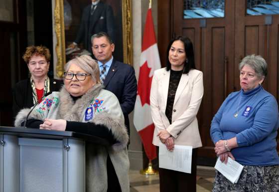 Heather Bear, a survivor with the Survivors Circle for Reproductive Justice, speaks at a news conference calling on the government to pass Bill S-228, An Act to amend the Criminal Code (sterilization procedures), in the Foyer of the House of Commons on Parliament Hill in Ottawa on Tuesday, Feb. 24, 2026. (Justin Tang / The Canadian Press)