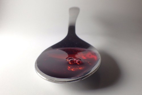 Police in a southern Alberta community are asking retailers for help to curb crimes associated with over-the-counter cough syrup. A spoonful of cough syrup is shown in Toronto, Saturday, Jan.25, 2014. THE CANADIAN PRESS/Graeme Roy