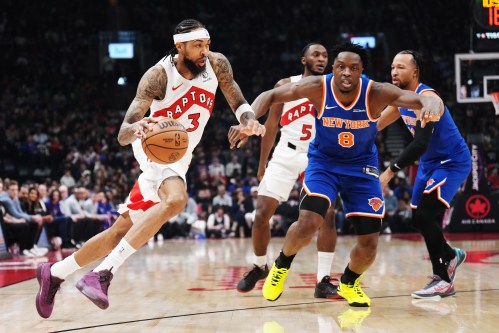 Toronto Raptors' Brandon Ingram (3) drives past New York Knicks' Og Anunoby (8) during first half NBA basketball action in Toronto on Tuesday, March 3, 2026. THE CANADIAN PRESS/Nathan Denette